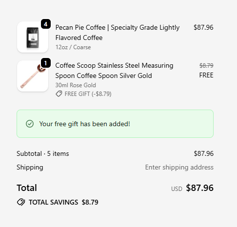 Shopify checkout showing a free coffee scoop gift with 100% discount applied, the gift line shows the original price crossed out and marked FREE